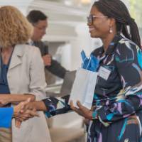 faculty smiling at each other